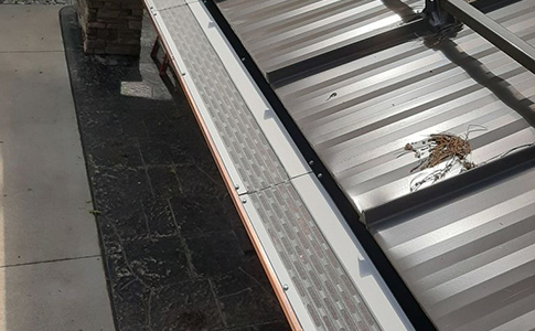 Fascia mounted gutter guards work great on metal roofs