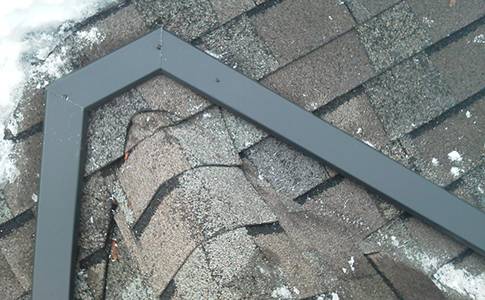 Roof heating systems for clearing snow and ice